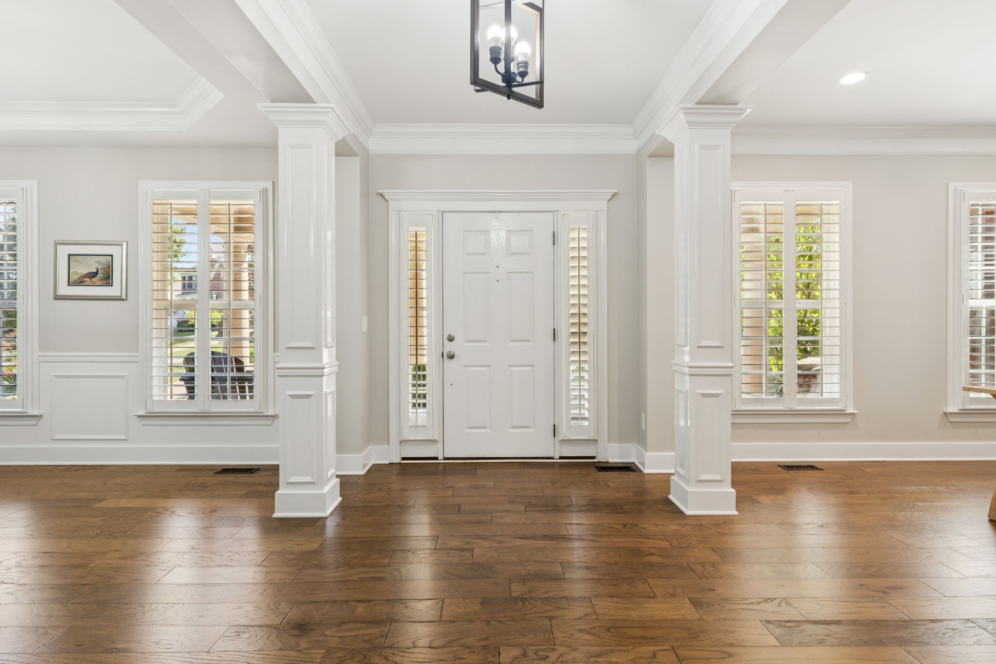 5520 Rathkeale Lane Franklin, TN 37067 - Photo 12 of 89 an empty room with wooden floor and windows with curtains view