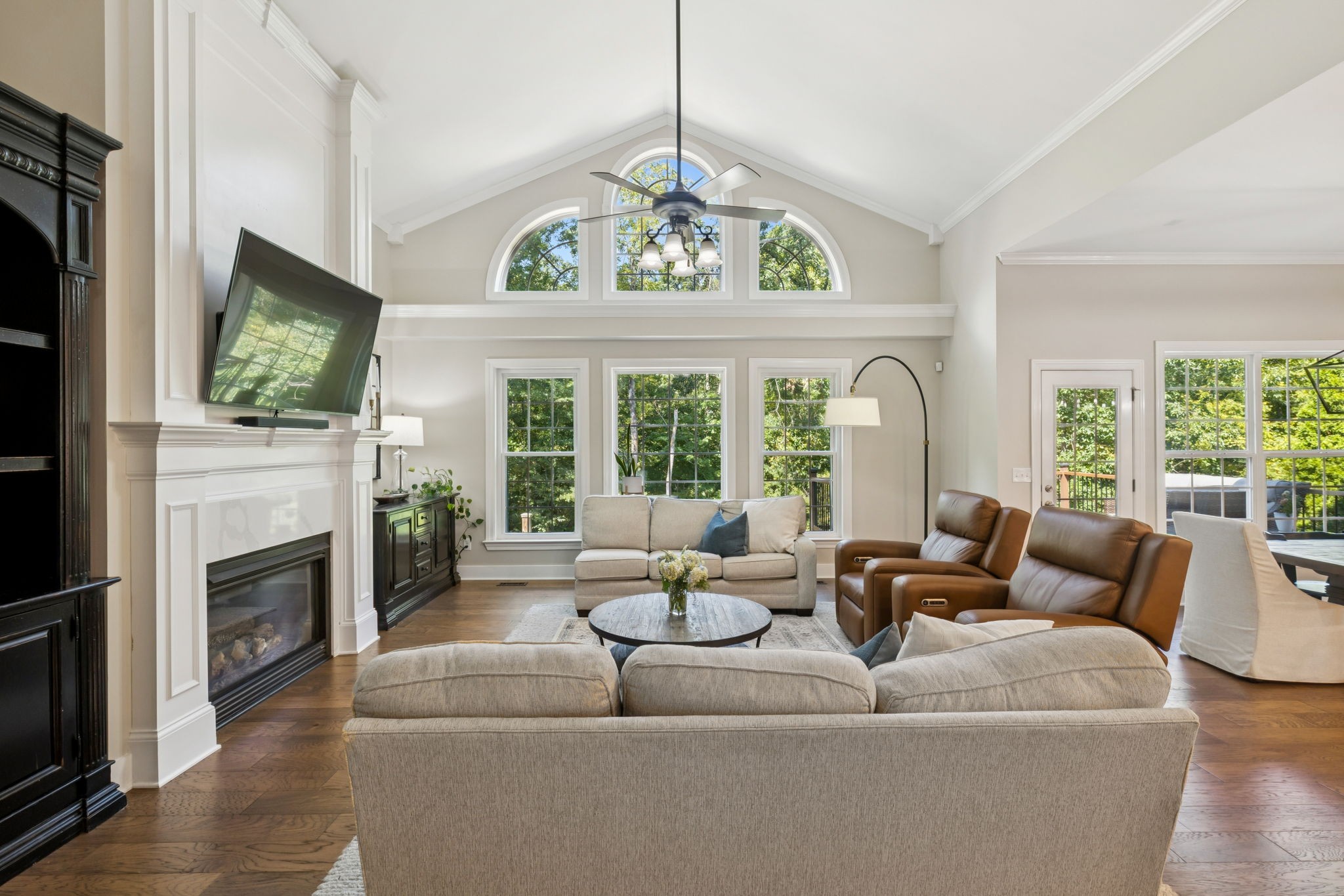5520 Rathkeale Lane Franklin, TN 37067 - Photo 21 of 89 a living room with furniture a fireplace and a flat screen tv