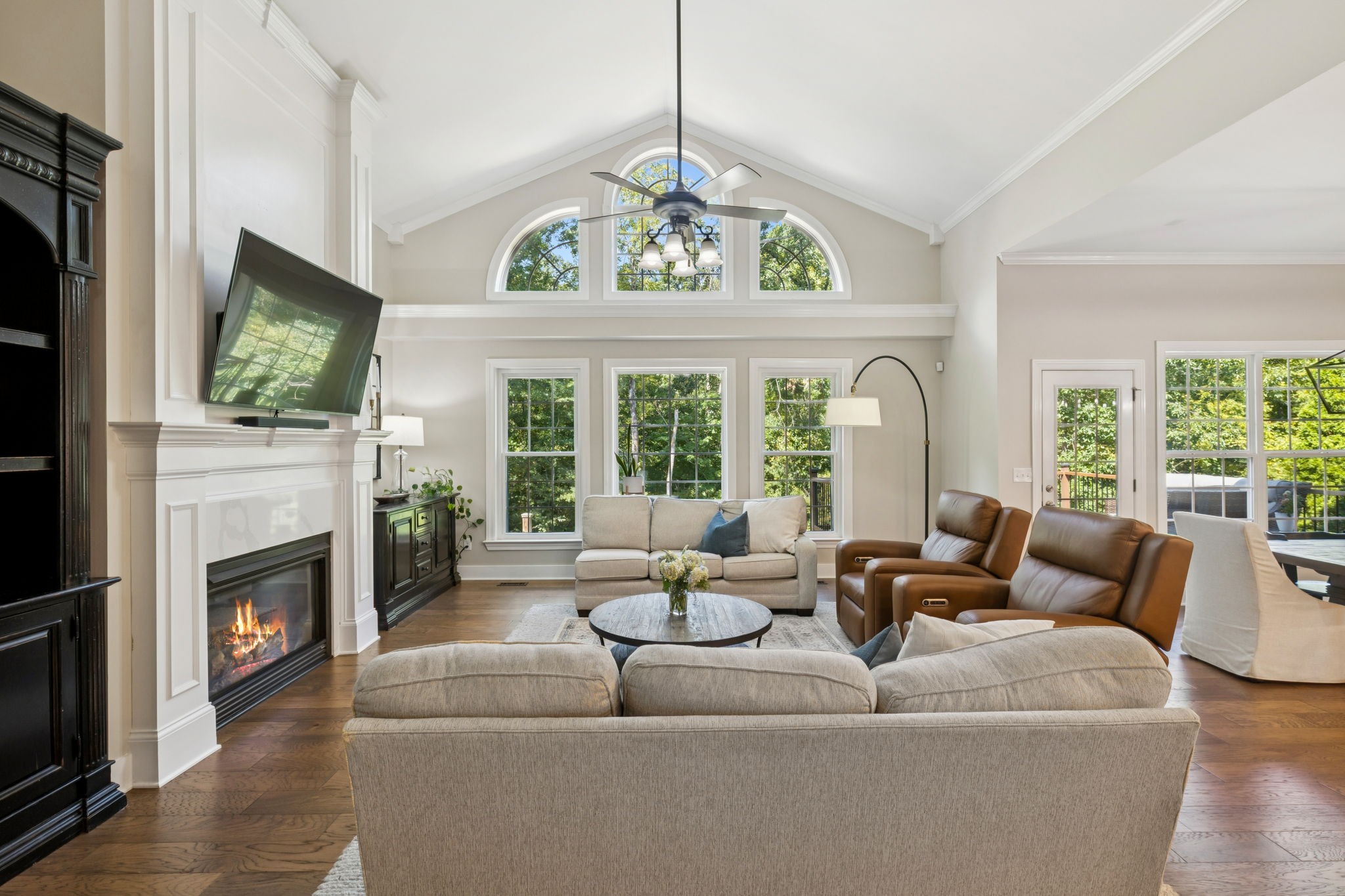 5520 Rathkeale Lane Franklin, TN 37067 - Photo 22 of 89 a living room with furniture a fireplace and a flat screen tv