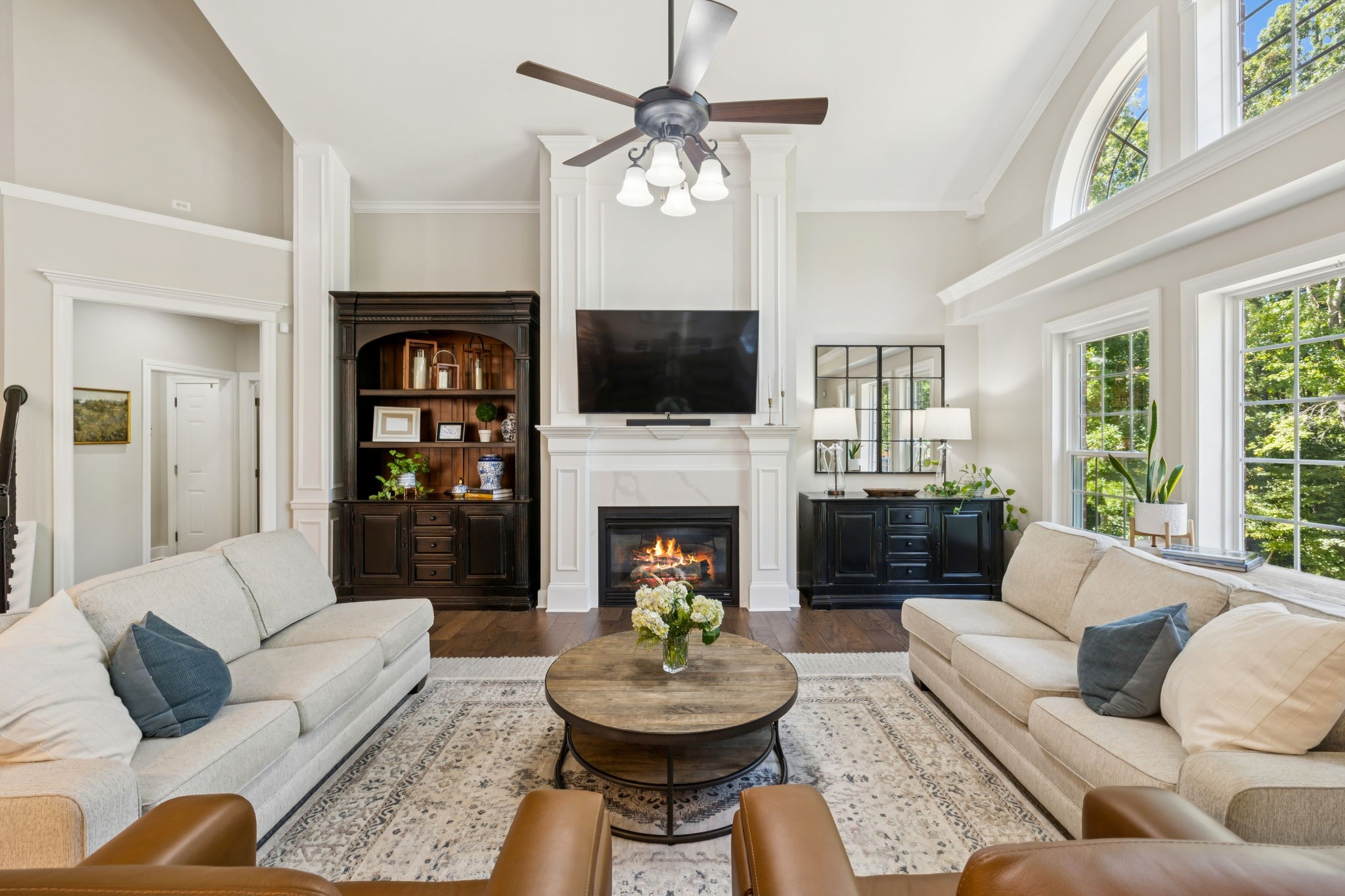 5520 Rathkeale Lane Franklin, TN 37067 - Photo 27 of 89 a living room with furniture a fireplace and a flat screen tv
