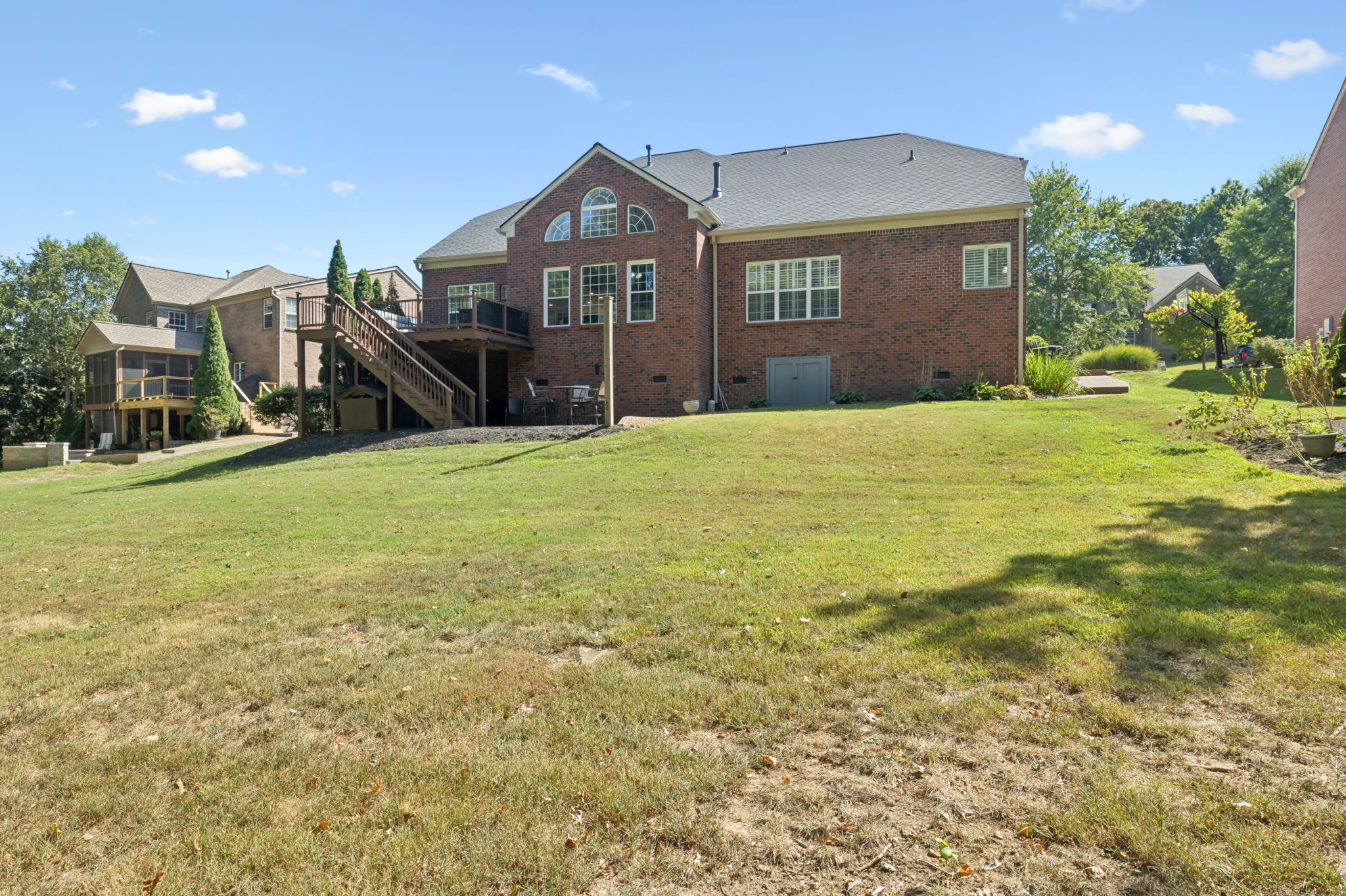 5520 Rathkeale Lane Franklin, TN 37067 - Photo 69 of 89 a view of a brick house with a yard and plants