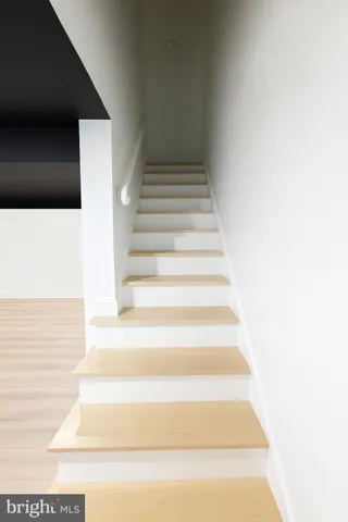 a view of staircase with white walls