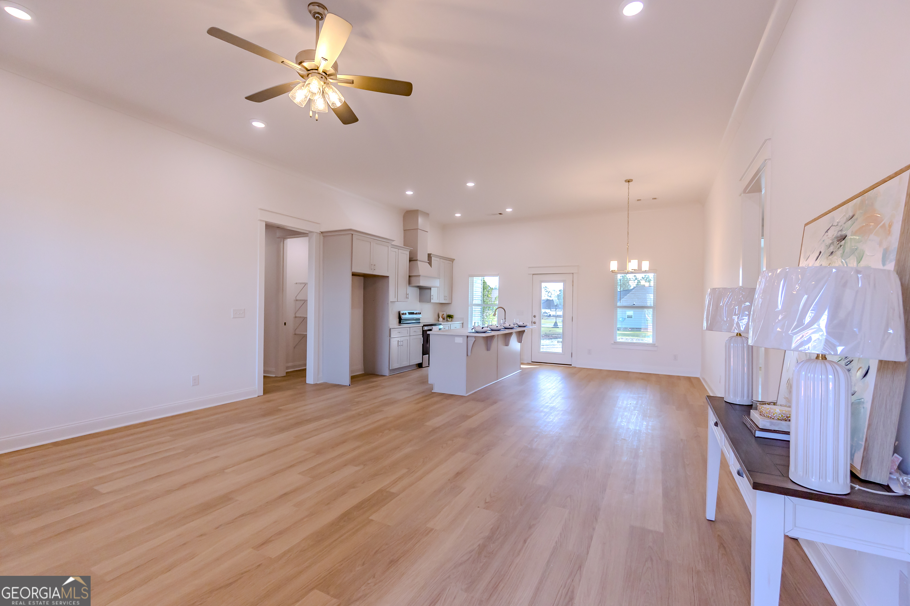 336 Mace Cannon Road Dublin, GA 31021 - Photo 16 of 62 a view of a livingroom with furniture a ceiling fan and wooden floor
