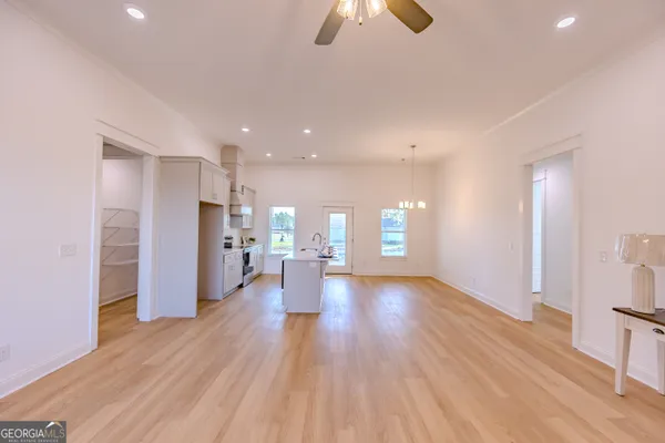 a kitchen with stainless steel appliances white cabinets and a sink