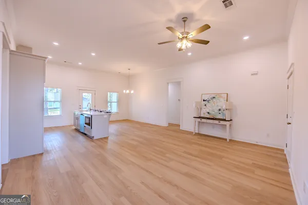 a kitchen with sink stove and cabinets
