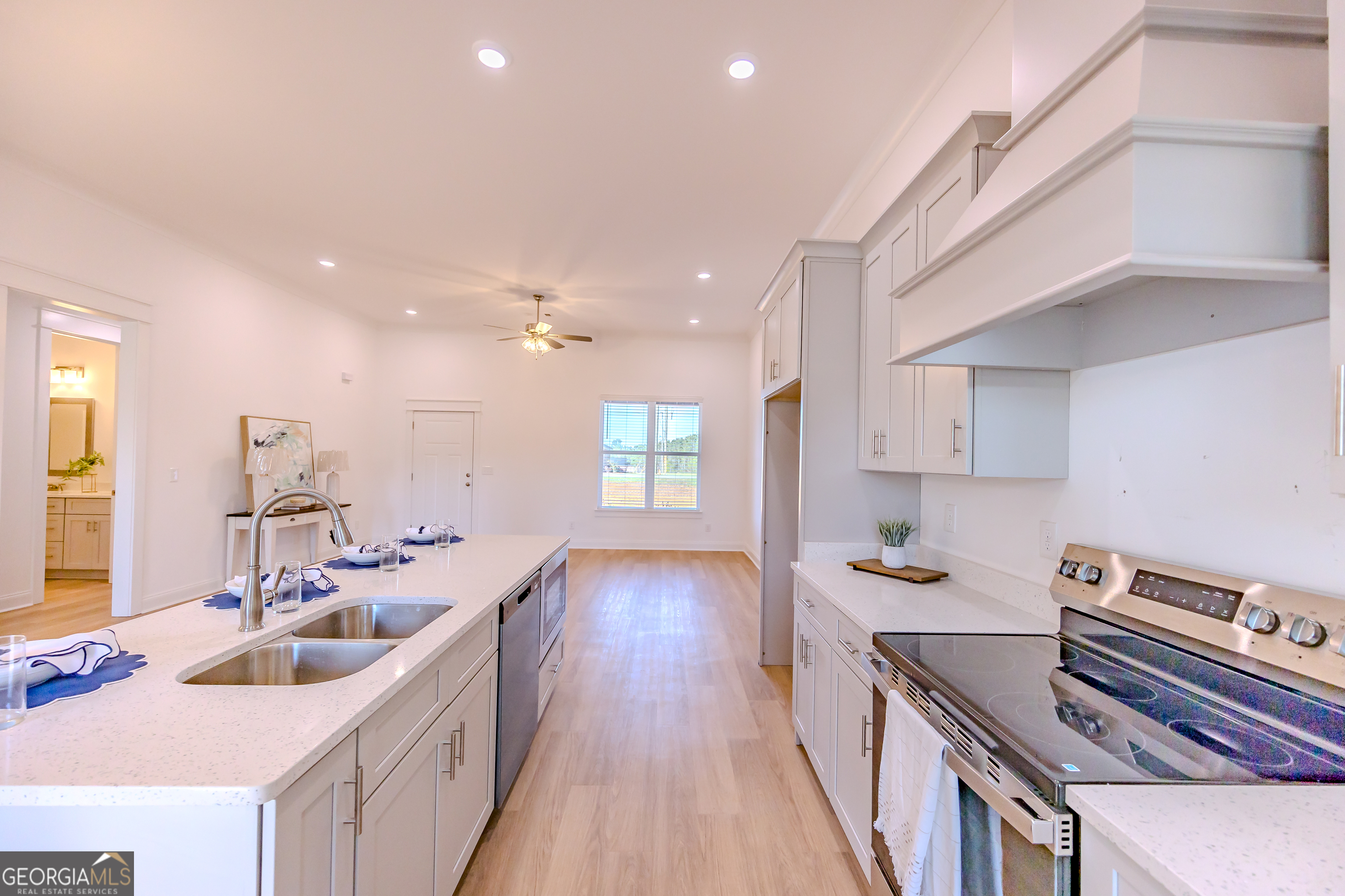 336 Mace Cannon Road Dublin, GA 31021 - Photo 22 of 62 a kitchen with sink stove and cabinets