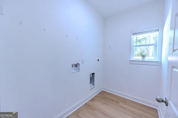 a view of a livingroom with a ceiling fan and window