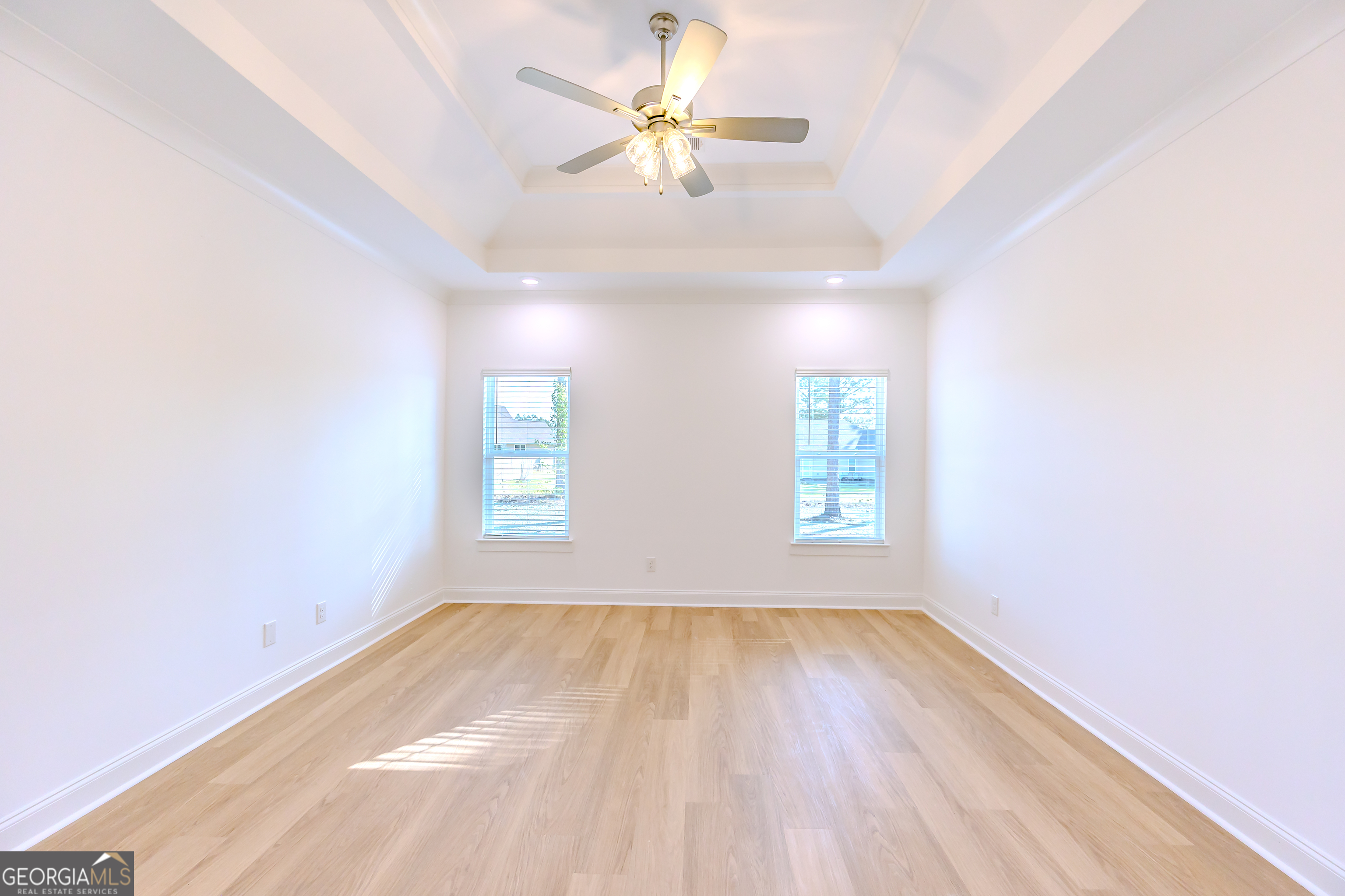 336 Mace Cannon Road Dublin, GA 31021 - Photo 29 of 62 wooden floor in an empty room with a window