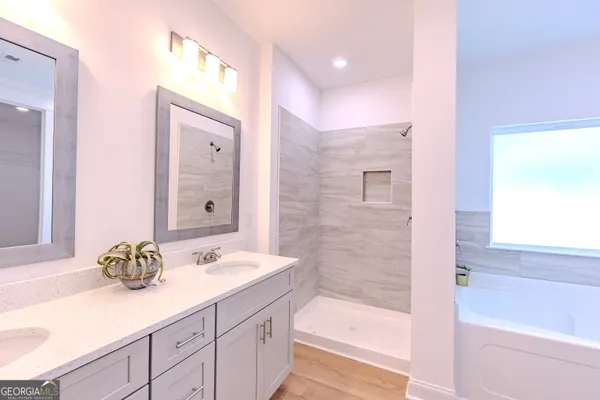 a white toilet sitting next to a shower