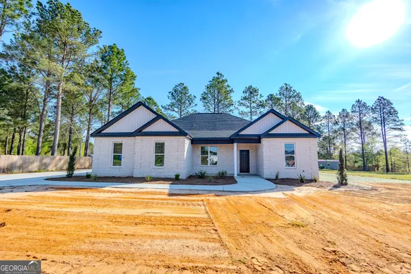 a house with trees in the background