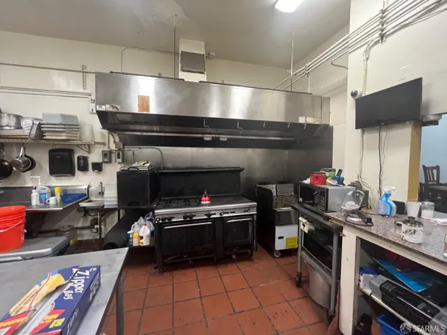 a kitchen with lots of appliances and cabinets