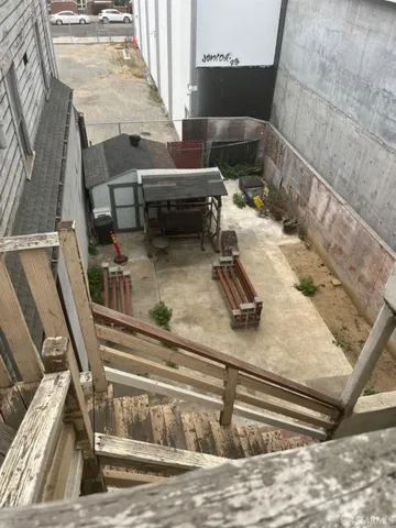 a view of storage and utility room with racks on the wall