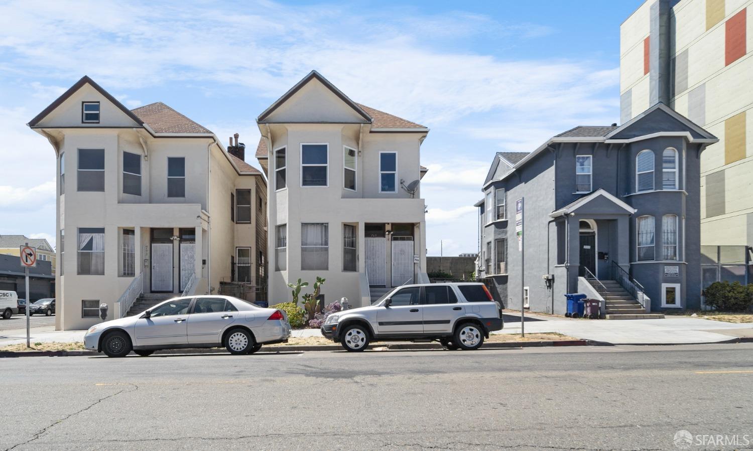 705 Jackson Street Oakland, CA 94607 - Photo 14 of 40 a car parked in front of a white house