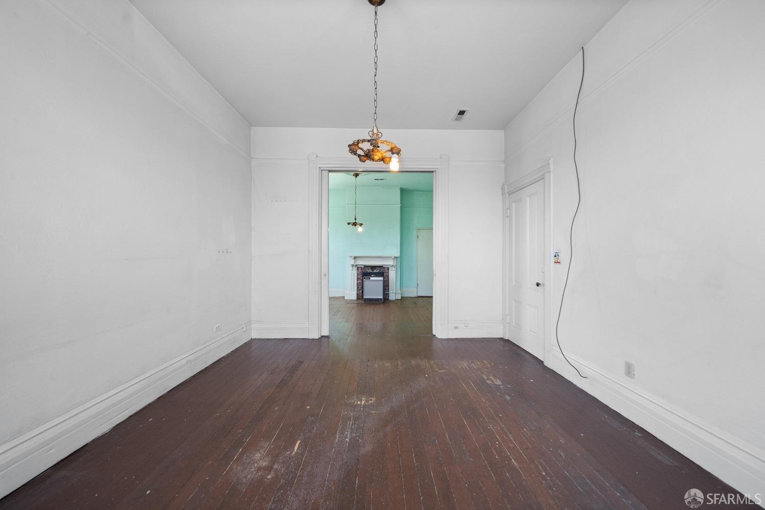 705 Jackson Street Oakland, CA 94607 - Photo 17 of 40 a view of a room with wooden floor and window