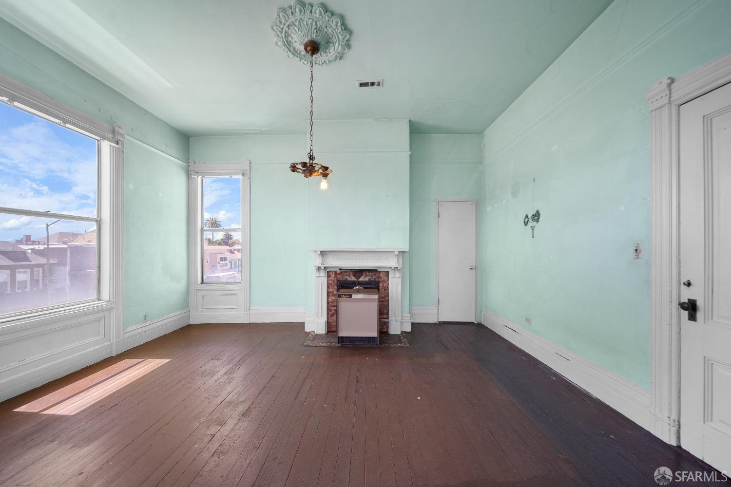 705 Jackson Street Oakland, CA 94607 - Photo 22 of 40 wooden floor in an empty room with a window