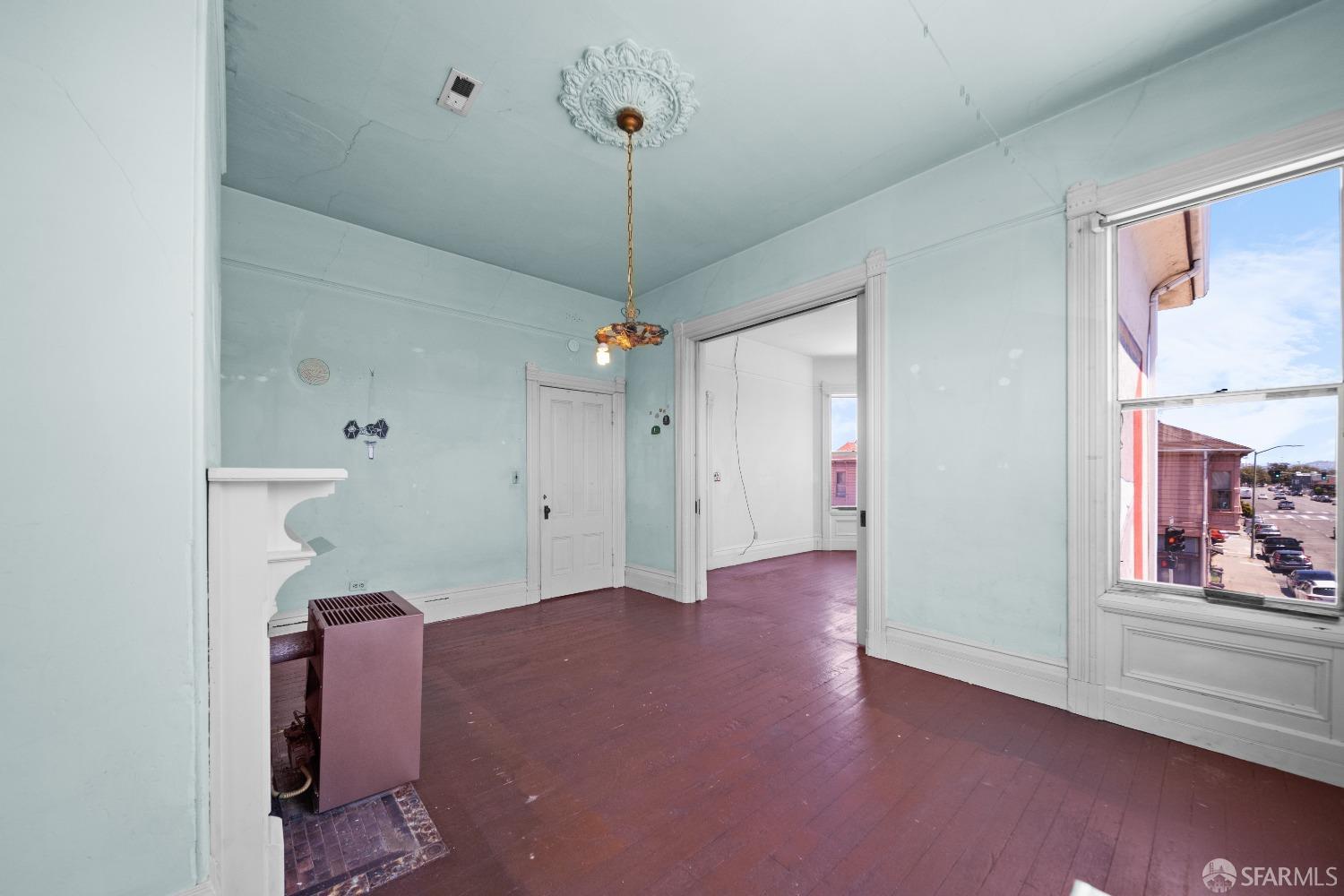 705 Jackson Street Oakland, CA 94607 - Photo 24 of 40 a view of a room with wooden floor and window