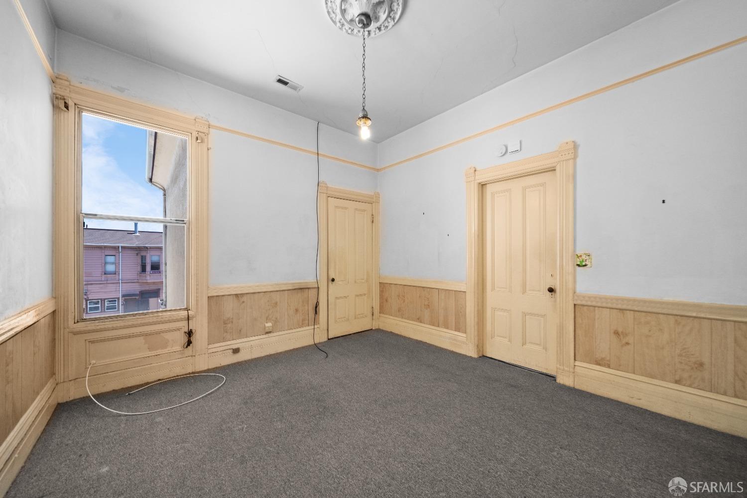 705 Jackson Street Oakland, CA 94607 - Photo 26 of 40 a view of an empty room with a window