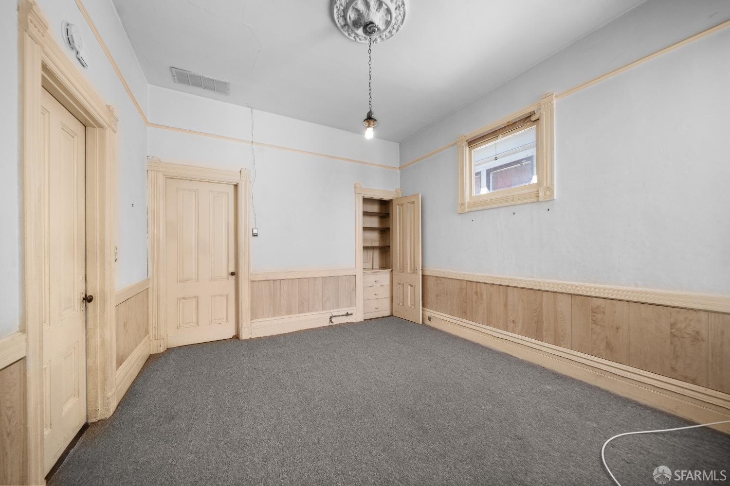 705 Jackson Street Oakland, CA 94607 - Photo 27 of 40 a view of an empty room with a window