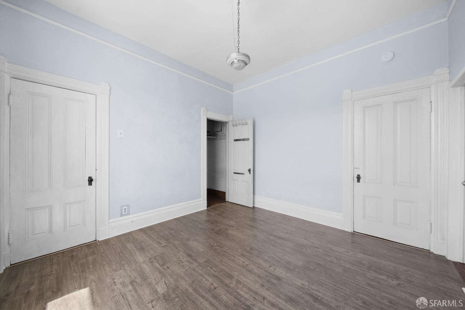 705 Jackson Street Oakland, CA 94607 - Photo 29 of 40 a view of an empty room with wooden floor