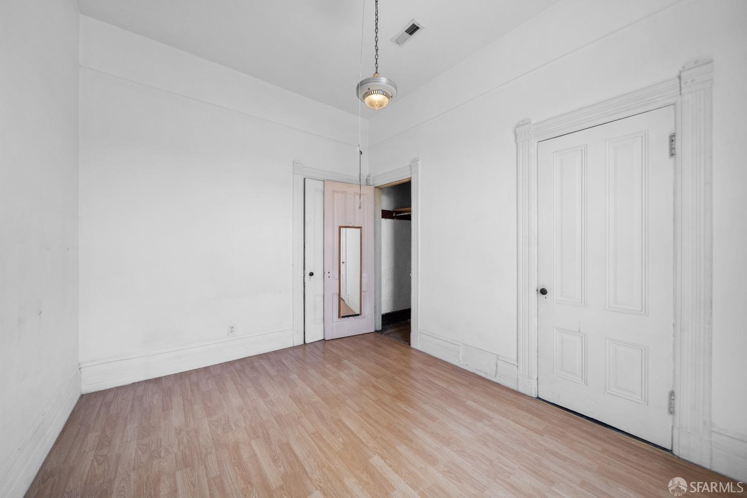 705 Jackson Street Oakland, CA 94607 - Photo 34 of 40 a view of an empty room with wooden floor
