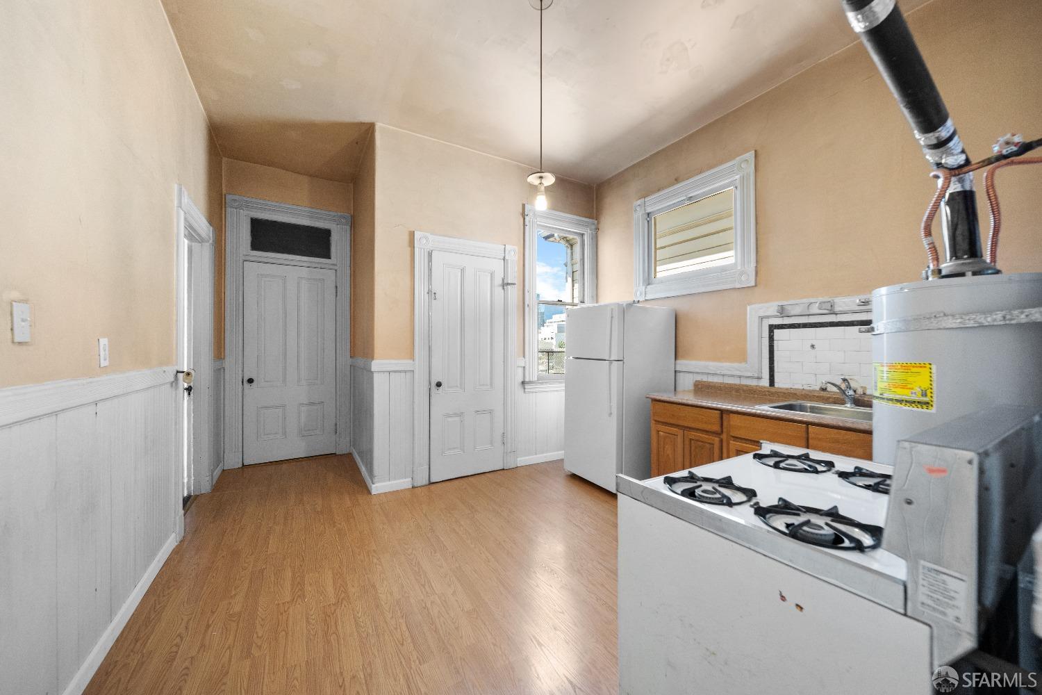 705 Jackson Street Oakland, CA 94607 - Photo 35 of 40 a kitchen with a stove and a refrigerator