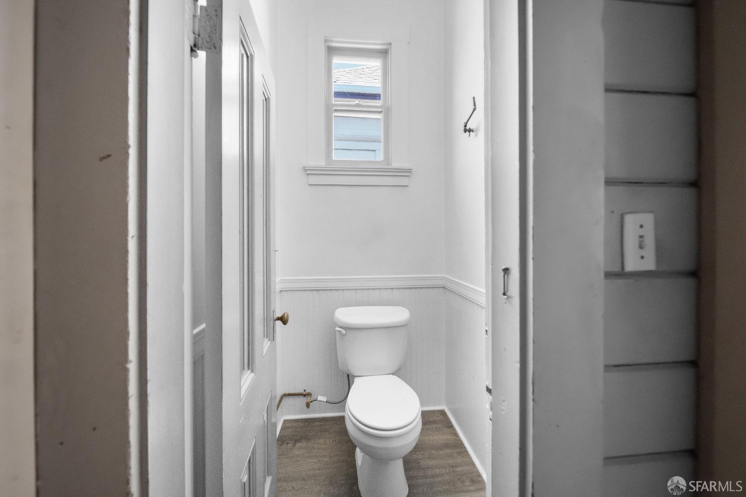 705 Jackson Street Oakland, CA 94607 - Photo 38 of 40 a bathroom with a toilet and a sink