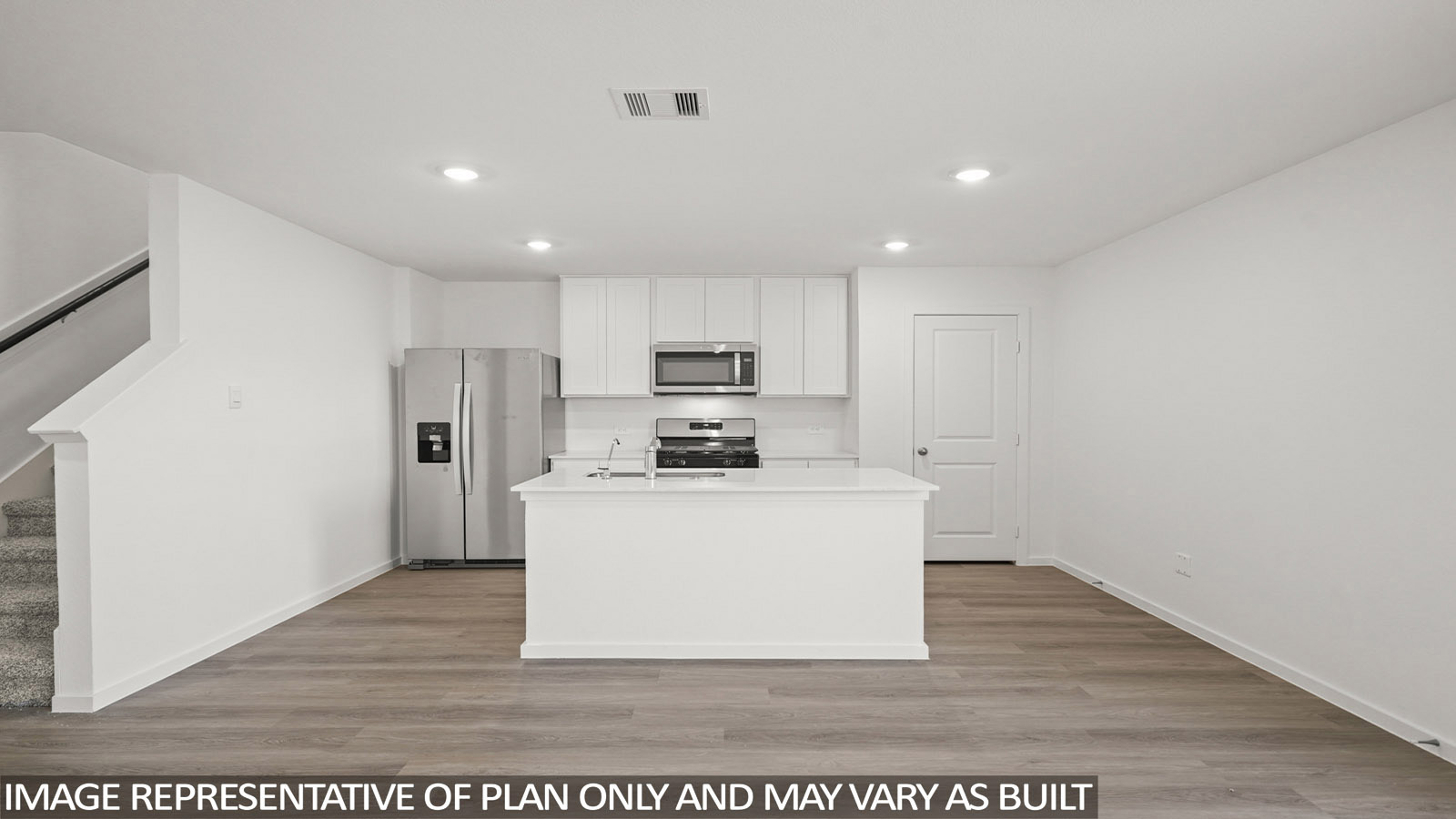 116 Baby Calf Roping Road Jarrell, TX 76537 - Photo 6 of 23 A contemporary kitchen space boasts an island and stainless steel appliances, ready for culinary endeavors.