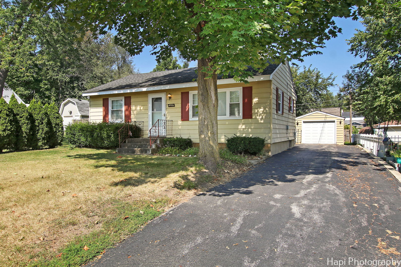 4906 Maple Hill Drive McCullom Lake, IL 60050 - Photo 1 of 23 a front view of a house with garden