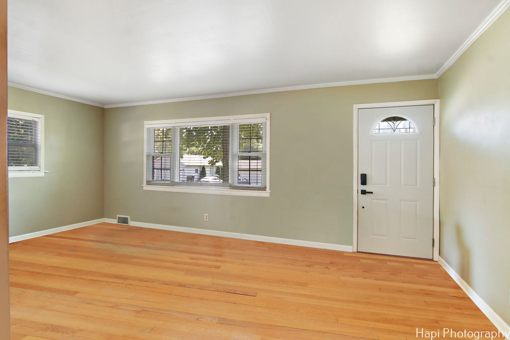 4906 Maple Hill Drive McCullom Lake, IL 60050 - Photo 2 of 23 a view of an empty room with wooden floor and a window