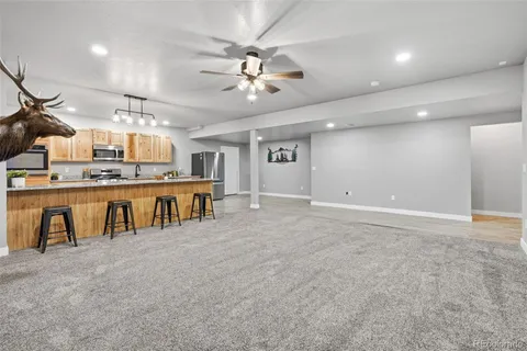 a view of a kitchen with stainless steel appliances granite countertop lots of counter top space