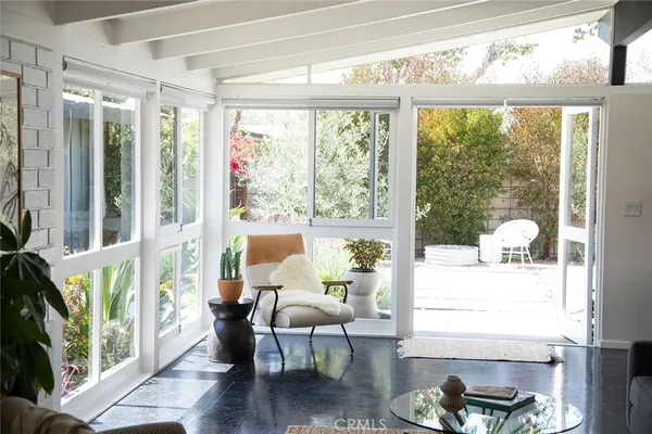 a living room with furniture and a large window
