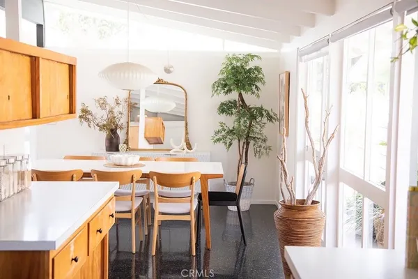 a bathroom with a sink a toilet a mirror and shower curtain