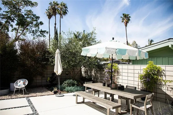 a living room with furniture potted plant and a fireplace