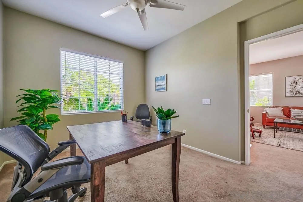 33391 Manchester Road Temecula, CA 92592 - Photo 8 of 32 a view of a dining room with furniture and a potted plant