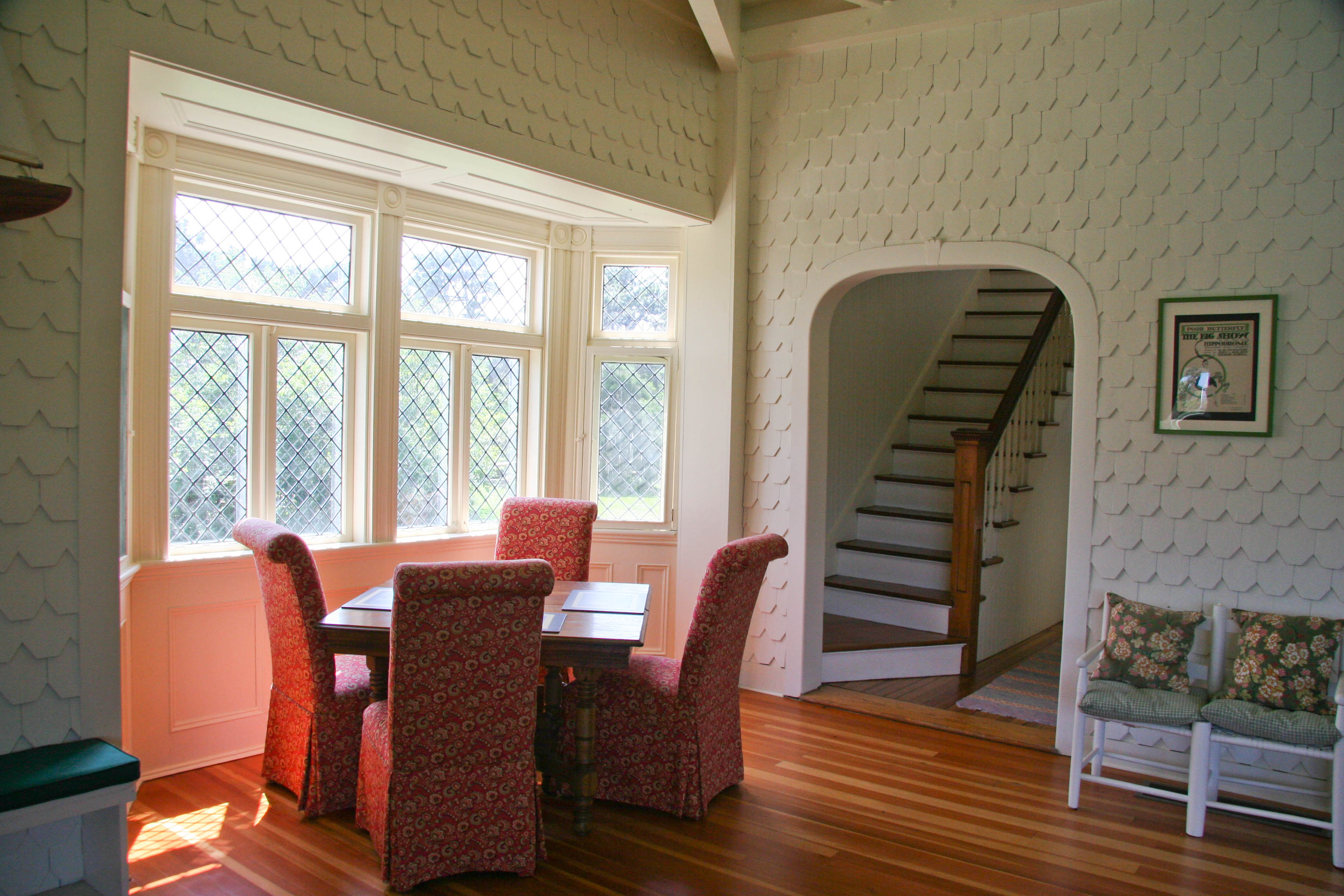 144 Surfside Road Nantucket, MA 02554 - Photo 13 of 46 a view of a dining room with furniture and wooden floor