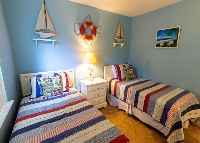 78 North Myrtle Drive, Unit 110 Santa Rosa Beach, FL 32459 - Photo 14 of 19 a bedroom with a bed and painting on the wall