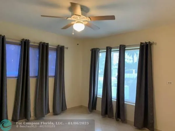 a view of closet with furniture and a chandelier