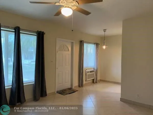 a view of a bathroom with a shower and a sink