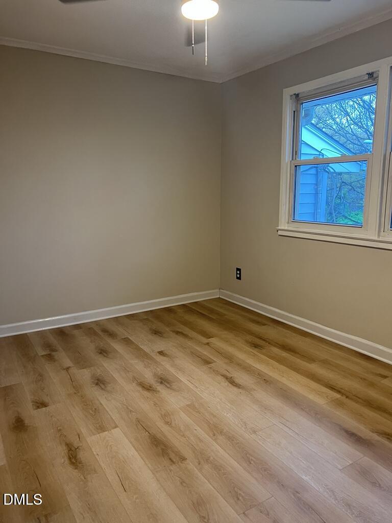 703 Daniels Street, Unit C Raleigh, NC 27605 - Photo 6 of 8 a view of empty room with window
