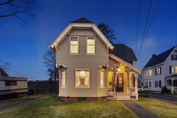 a front view of a house with a yard