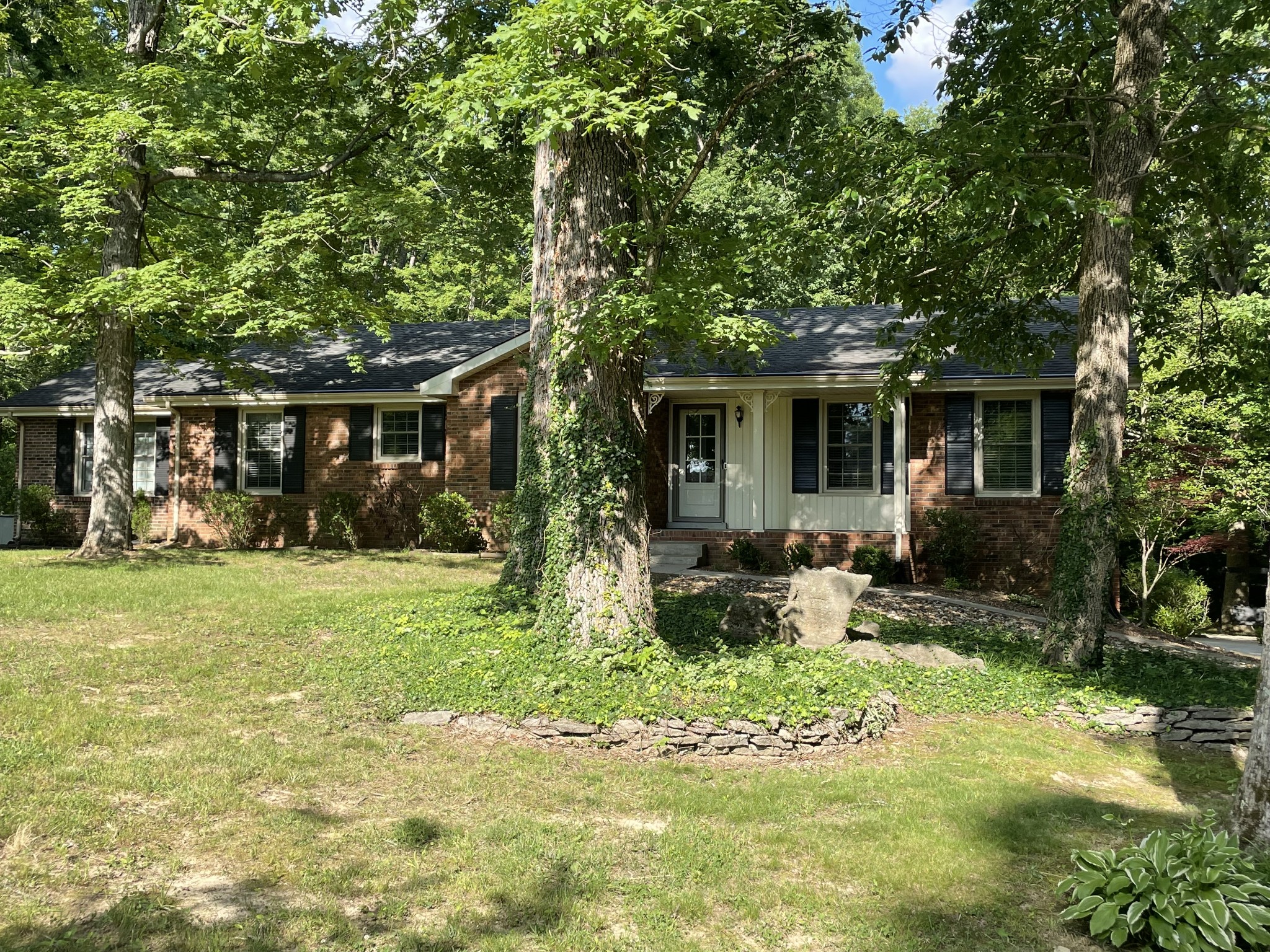 1224 Poplar Ridge Road Chapmansboro, TN 37035 - Photo 2 of 40 a front view of house with a garden