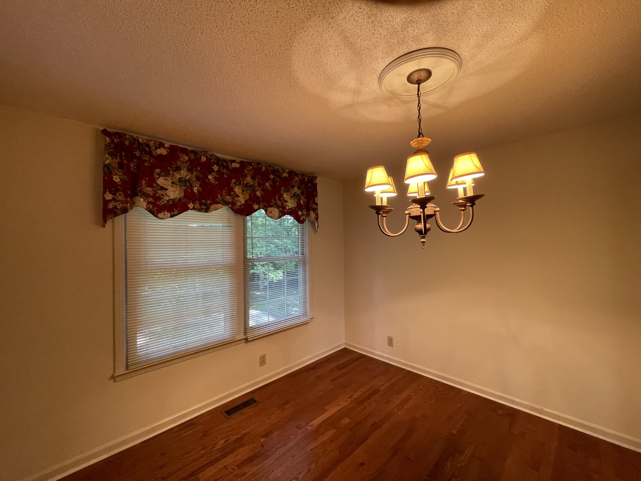 1224 Poplar Ridge Road Chapmansboro, TN 37035 - Photo 24 of 40 a view of a room with wooden floor and fan