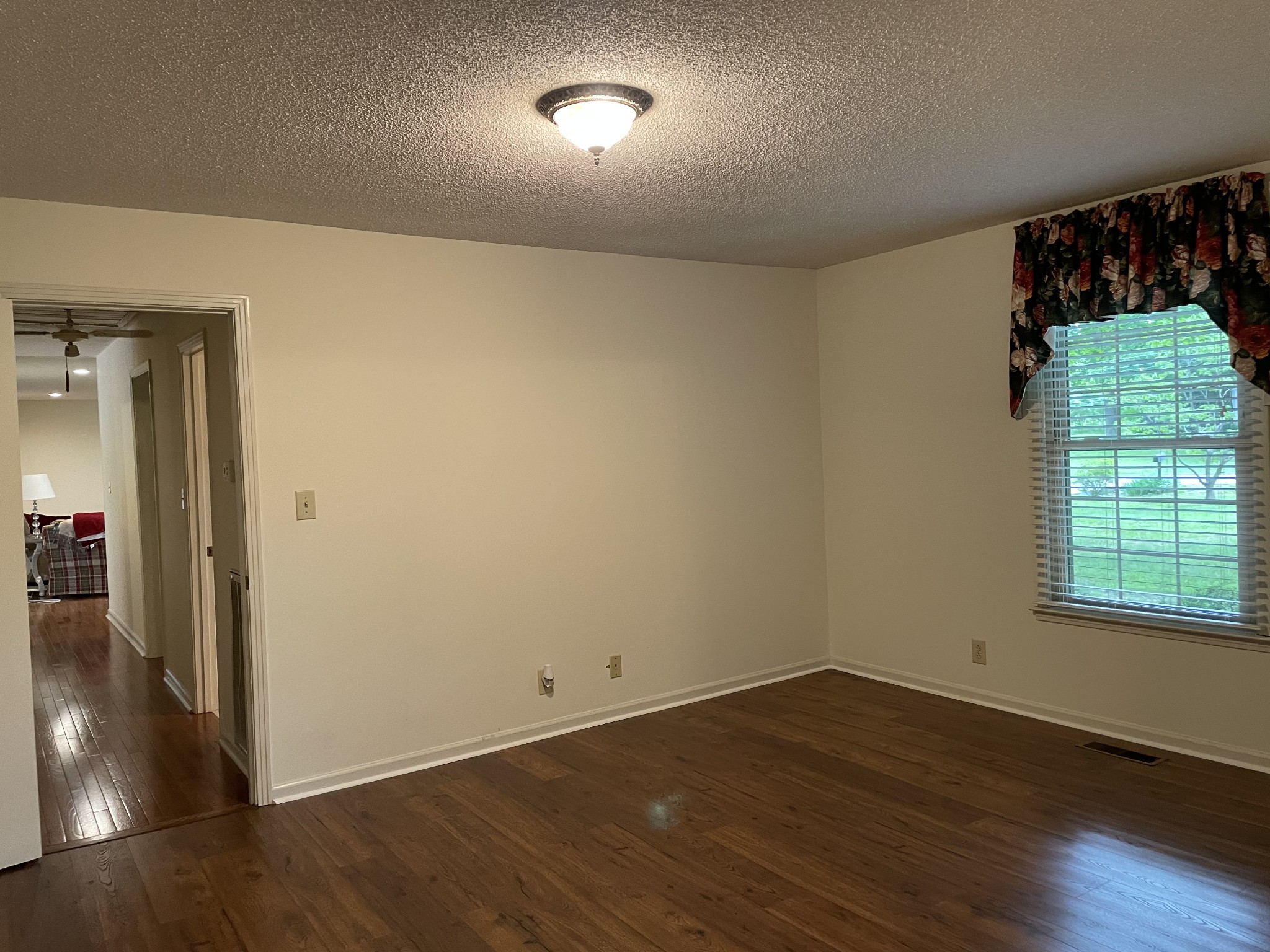 1224 Poplar Ridge Road Chapmansboro, TN 37035 - Photo 34 of 40 an empty room with wooden floor mirror and windows