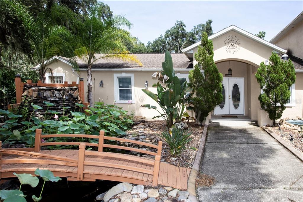 5112 Bell Shoals Road Valrico, FL 33596 - Photo 1 of 1 Front Entrance waterfall & pond