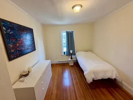 a balcony with furniture and wooden floor
