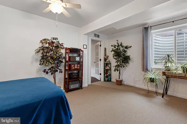 a bedroom with furniture and a fireplace