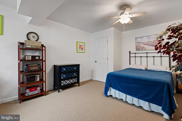a bedroom with a bed and a sink