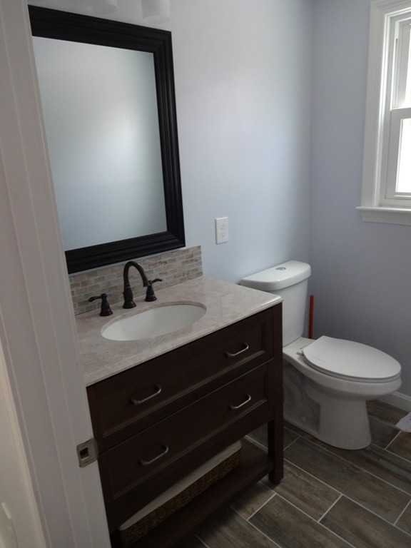 5 Bagley Road Holbrook, MA 02343 - Photo 5 of 12 a bathroom with a toilet sink and mirror