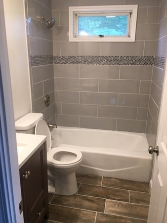 5 Bagley Road Holbrook, MA 02343 - Photo 9 of 12 a bathroom with a toilet and a bathtub