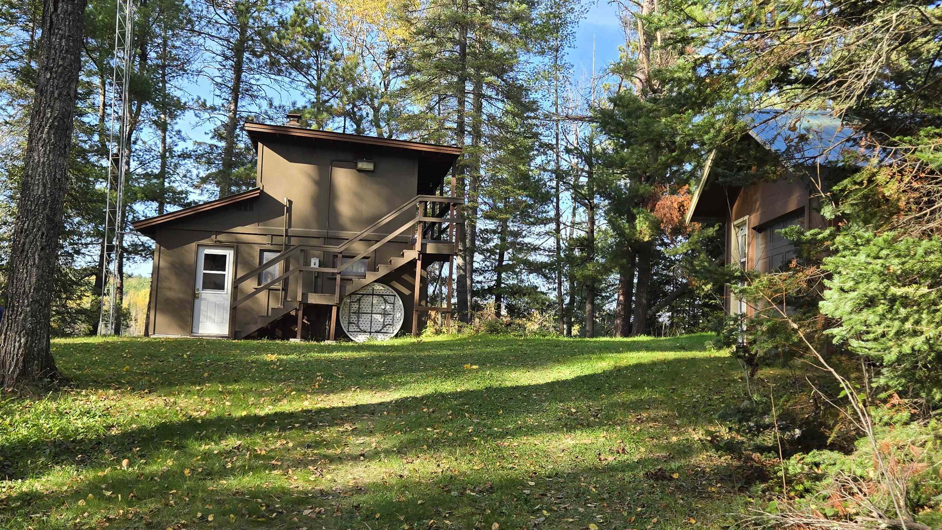7178 Gold Mine Road Orr, MN 55771 - Photo 2 of 36 Rear view of property featuring stairway, a yard, a deck, and a chimney